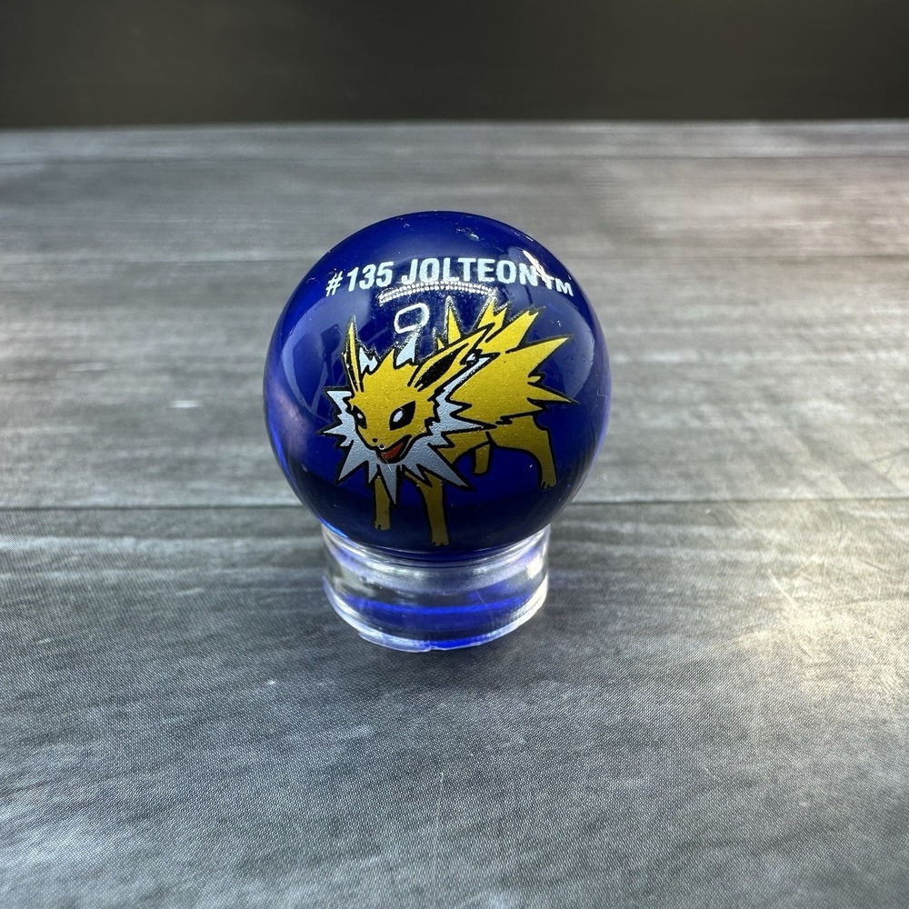 Vintage ToyBiz Pokemon Marble Jolteon #135 Glass Marble Clear Blue